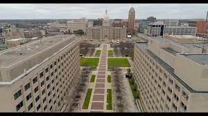 Daytime aerial view of Lansing state government buildings and capitol